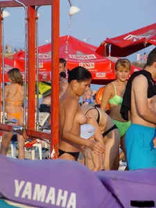 Beach voyeur girls in bikinis, thongs and topless