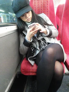 Asian babe on the bus in skirt and stockings