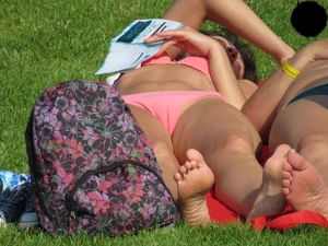 Milf at the pool in a pink bikini with camel toe