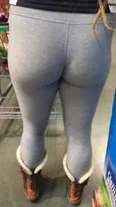 Amazing teen wearing grey leggings at the supermarket