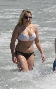 Big boobed thick blonde on the beach in a bikini