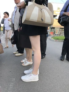 Candid girl wearing a short skirt crossing the street, awesome pale legs