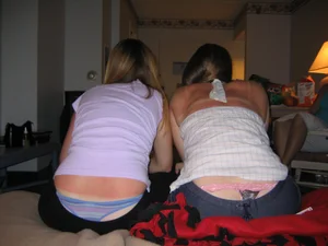 Girls Sitting on Bed With Whaletail Home Creepshot
