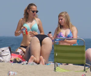 3 girls on the beach in bikinis with big boobs, one brunette and two blondes