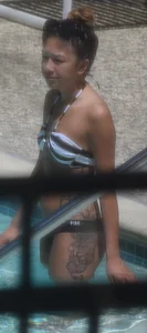 Sexy Asian girl with tattoos in a thong bikini