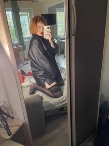Topless Ginger Girl in Panties, Torn Stockings And a Leather Jacket Bedroom Selfies