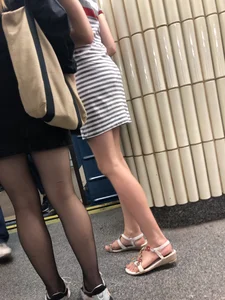 Nice candid legs in black pantyhose in a subway train