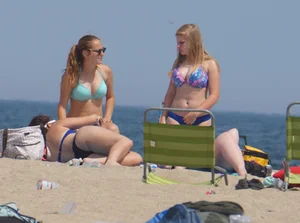 3 girls on the beach in bikinis with big boobs, one brunette and two blondes