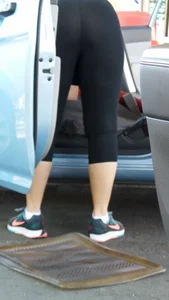 Girl in tight see through leggings with nice ass cleaning her car