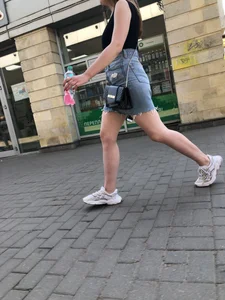 Hot chick wearing a fringed skirt walking up the stairs