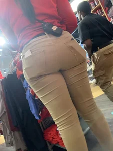 Bunch of girls in various outfits at a Cardinals baseball game