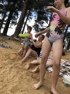 Girls in One-Piece Body Swimsuits Running Towards Water and Swimming - Beach Photo Gallery
