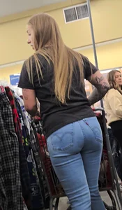Girl with tattoos in tight jeans