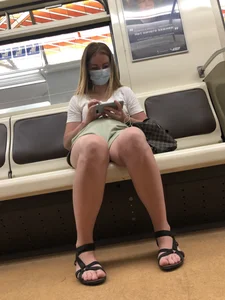 Girl in Shorts, Sandals and a Mask With Hot Legs in the Subway Train Creepshots