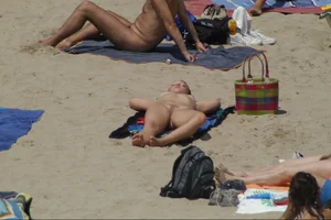 Girls on a nude beach in Sitges, Spain