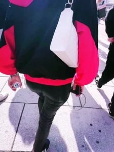 Ass in leather pants closeups on the street