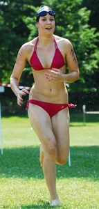 Wet Tall Muscular Female Runner in Red Swimsuit Candid Pic
