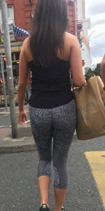 Sexy girl walking in grey patterned leggings with friend in tight jeans