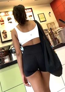 hot petite Indian chick showing some T&A in skimpy workout clothes
