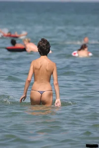 A bunch of sexy beach voyeur babes in bikinis, thongs and topless