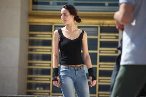 Hot brunette skateboarder in tight jeans and with hard nipples