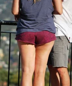 Girl in short maroon shorts with decent booty