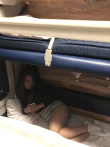 Cute Girl in Mini Shorts and White Socks at the Train Sleeping Car Candid Photos