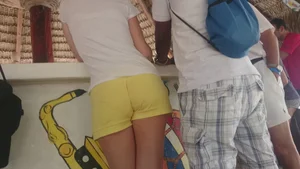Milf in yellow shorts with vpl and a wedgie