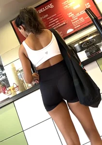 hot petite Indian chick showing some T&A in skimpy workout clothes