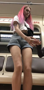 Girl With Pink Hair and Hot Legs in Denim Shorts in the Subway Train Candid Photo Gallery