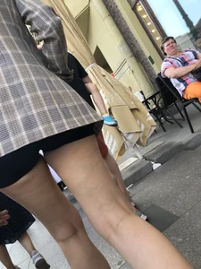 Closeups of a gorgeous girl wearing spandex mini shorts crossing the street