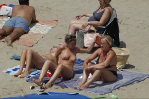 Girls on a nude beach in Sitges, Spain