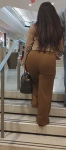 Brunette in brown pants jiggly