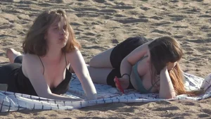 Girls in Underwear Lying on Sand Beach Creepshot