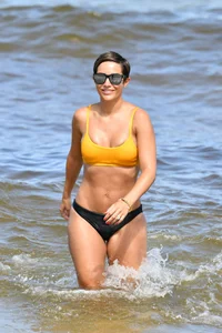 Frankie Bridge nip slips in a bikini on the beach