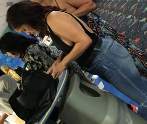 Thick brunette in tight jeans and showing some side boob