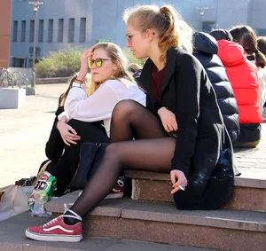 Girl with awesome legs in black pantyhose
