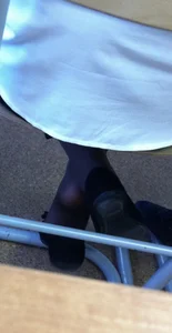 College candid teens' flats under desk, dangle creepshots