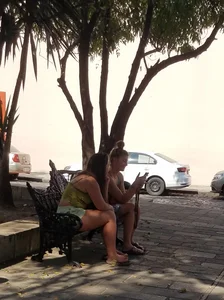 Nice legs and feet in the park (one of them showing little else)