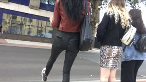 Chav brunette with a nice ass and vpl in tight black leather pants