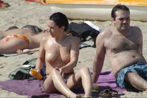 Girls on a nude beach in Sitges, Spain