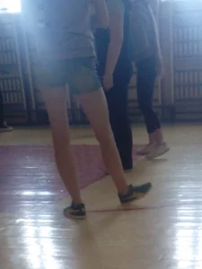 Young Girl in Shorts on a Gymnasium