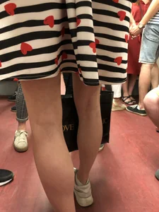 Girl in Striped Dress with Hearts Pattern Skinny Legs Subway Closeup Creepshot