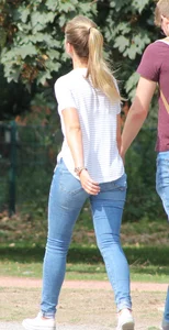 Blonde chick walking with her boyfriend in tight jeans