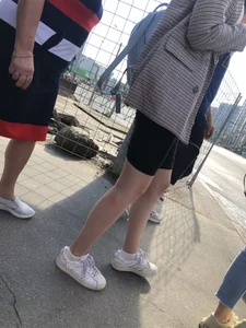 Hot slim legs in shorts of a candid girl in a public bus