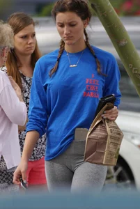 Hot college girl getting food in grey leggings
