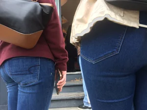 2 nice asses in tight jeans standing around