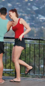 Redhead beauty in short shorts showing some cheeks and panties