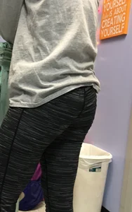 Ass standing around in tight grey patterned leggings