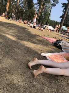 Pale Girl in Swimsuit Lying on a Lake Beach With Her Friends Creepshots Gallery